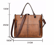 Brown Leather Handbag With Adjustable Strap And Multiple Pockets