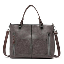 Brown Leather Handbag With Adjustable Strap And Multiple Pockets