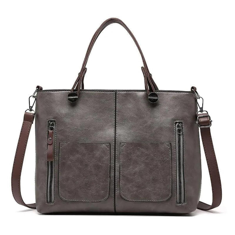 Brown Leather Handbag With Adjustable Strap And Multiple Pockets