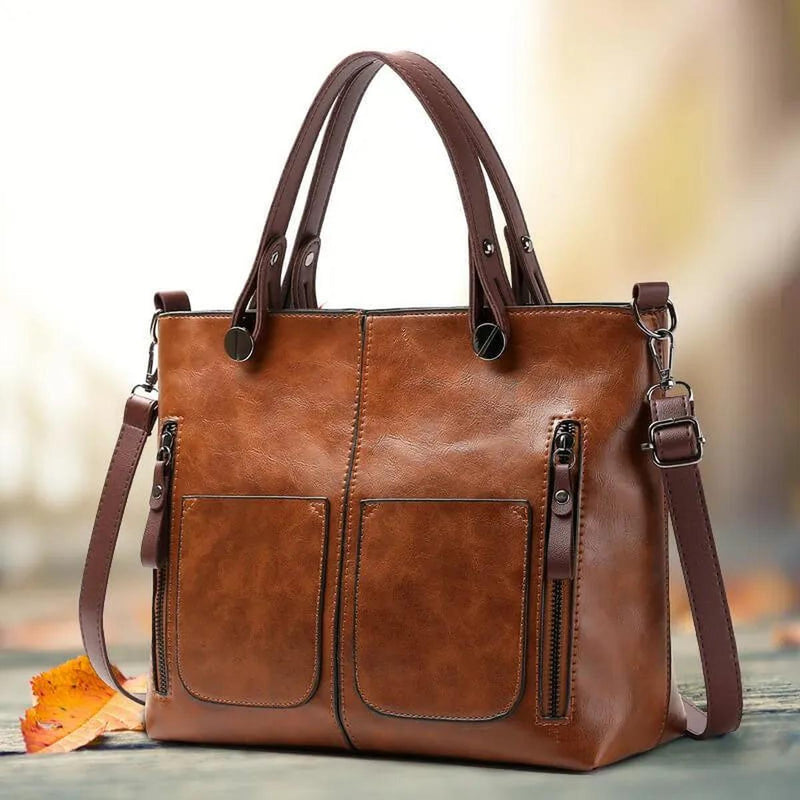 Brown Leather Handbag With Adjustable Strap And Multiple Pockets