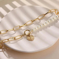 Gold tone Pearl-Embellished Crossed Heart Pendant