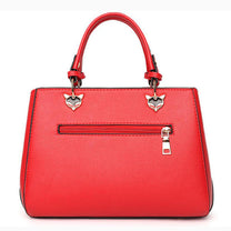 Women&#39;s Handbag With Hairball Embellishments And Patchwork Design