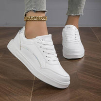 Women&#39;s White Leather Sneakers With Metallic Accents